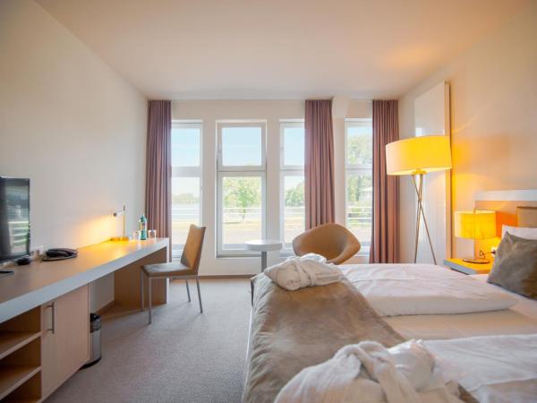 Aspria Hannover : photo 1 de la chambre chambre double ou lits jumeaux - vue sur lac