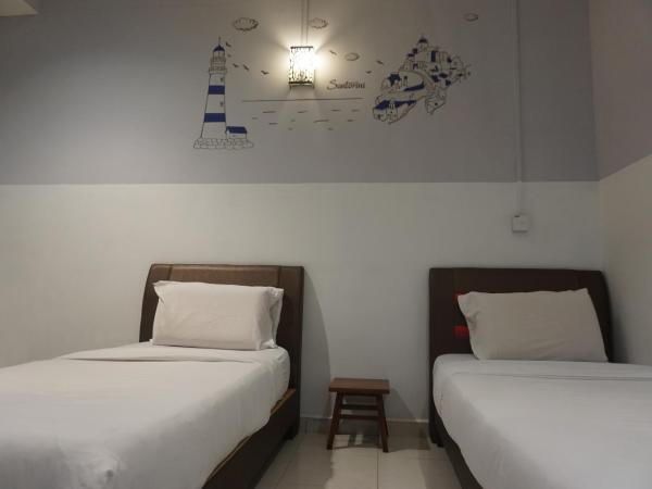 S & S Guest House Kuantan : photo 6 de la chambre chambre lits jumeaux standard