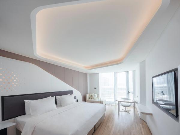 FlyZoo Hotel - Alibaba Future Hotel : photo 1 de la chambre hébergement deluxe hollywood avec balcon