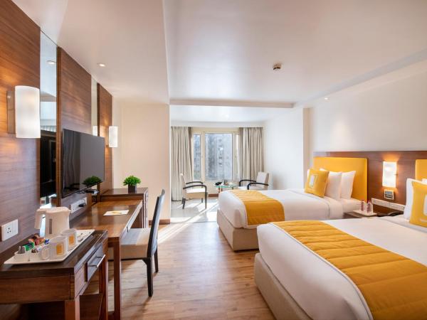 BloomSuites l Ahmedabad : photo 4 de la chambre chambre lits jumeaux supérieure - non-fumeurs