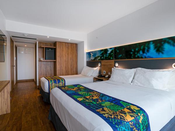Arena Leme Hotel : photo 2 de la chambre chambre triple deluxe