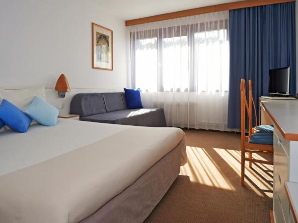 Novotel Poznań Malta : photo 3 de la chambre chambre double standard avec canapé