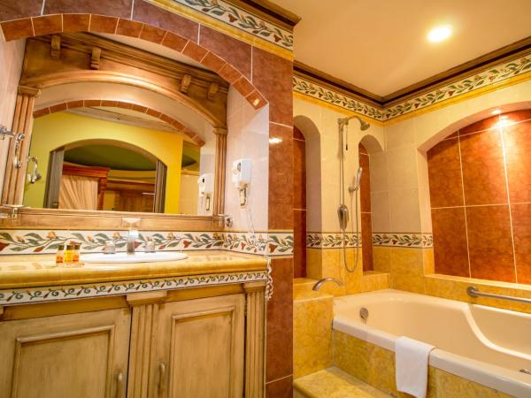Suites Flamboyanes : photo 8 de la chambre suite deluxe avec baignoire spa
