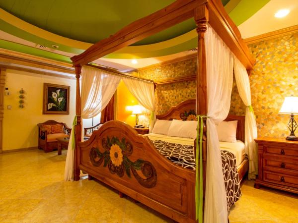 Suites Flamboyanes : photo 2 de la chambre suite deluxe avec baignoire spa