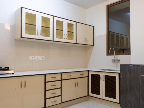 ROKPA Guest House : photo 4 de la chambre apartment with garden view and kitchen