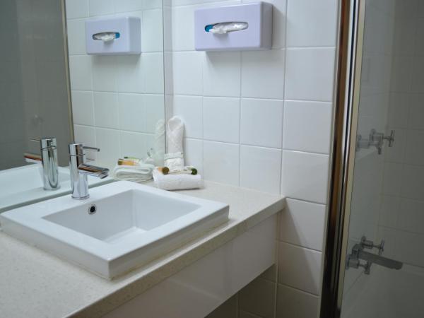 Airport Motel Brisbane : photo 1 de la chambre chambre lit queen-size deluxe