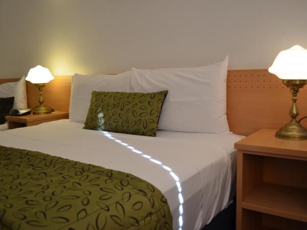 Airport Motel Brisbane : photo 3 de la chambre chambre lit queen-size deluxe