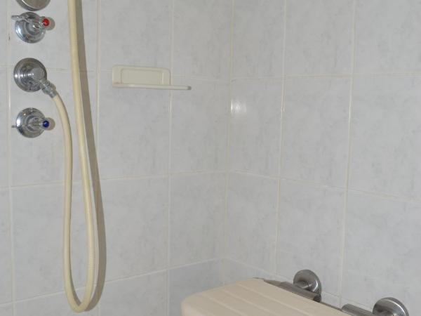 Airport Motel Brisbane : photo 1 de la chambre chambre lit queen-size - accessible aux personnes à mobilité réduite