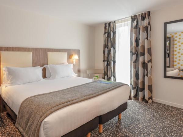 Holiday Inn Paris Opéra - Grands Boulevards, an IHG Hotel : photo 2 de la chambre chambre lit queen-size premium