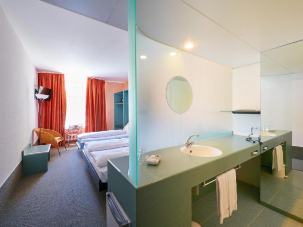 Hotel City am Bahnhof : photo 3 de la chambre chambre triple