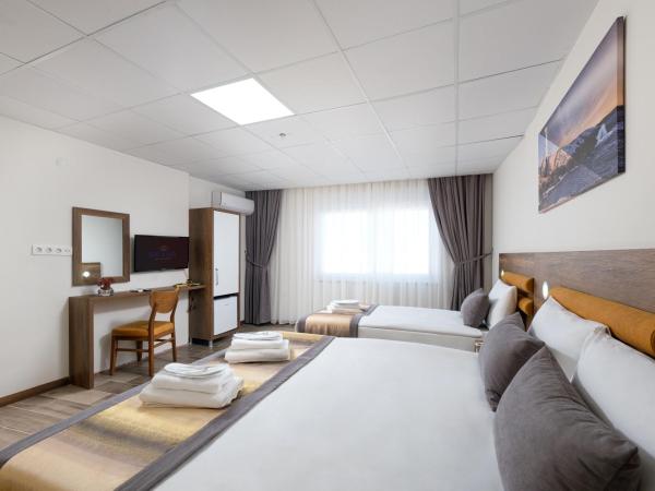 Grand Gulluk Hotel & Spa : photo 2 de la chambre chambre triple deluxe