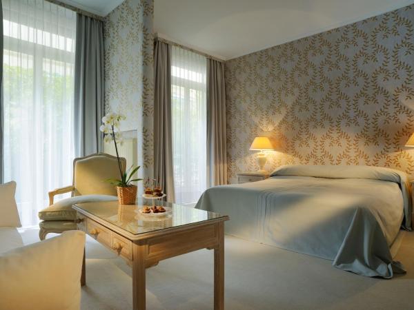 Grand Hotel Villa Castagnola : photo 1 de la chambre chambre double ou lits jumeaux - cour arrière