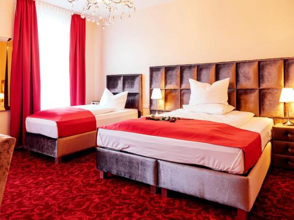 Hotel Hamburger Perle : photo 1 de la chambre chambre triple deluxe