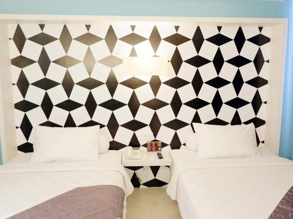 CROWN PRINCE Hotel Surabaya Managed by Midtown Indonesia : photo 2 de la chambre chambre lits jumeaux cozy
