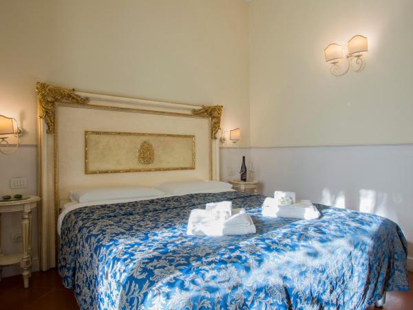 Relais Tiffany : photo 1 de la chambre chambre double ou lits jumeaux - vue sur jardin