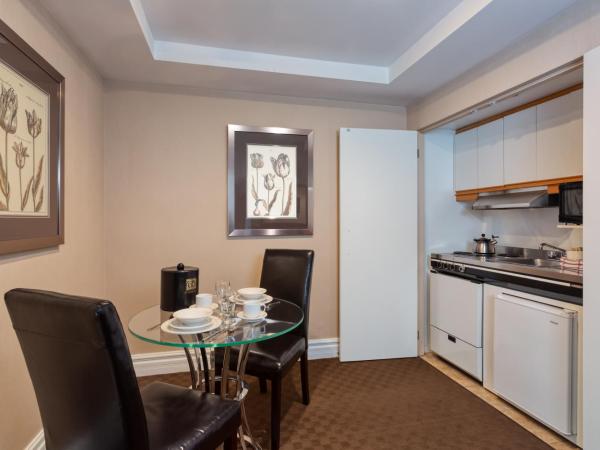 Hôtel Le Cantlie Suites : photo 8 de la chambre suite exécutive avec 2 lits doubles