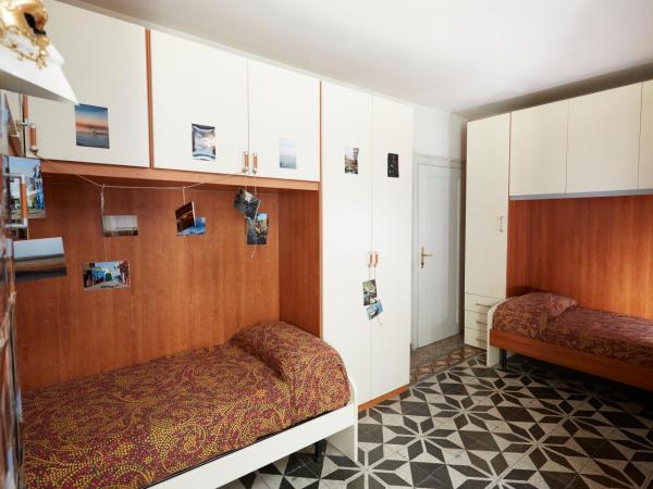 Ostello AMDG : photo 1 de la chambre chambre quadruple avec salle de bains privative