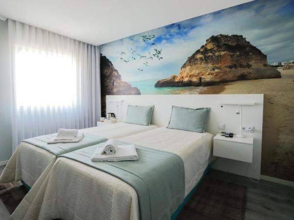 Golden Beach Guest House & Rooftop Bar : photo 4 de la chambre chambre lits jumeaux supérieure - vue sur ria formosa