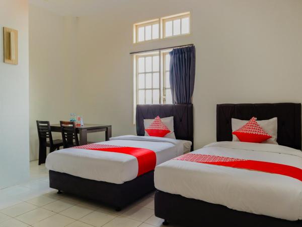 OYO 1111 Pasar Baru Inn : photo 1 de la chambre chambre lits jumeaux standard
