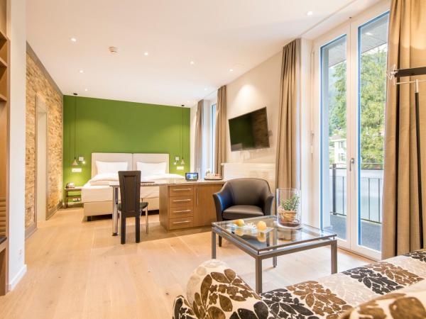 Belvedere Swiss Quality Hotel : photo 1 de la chambre chambre familiale - climatisation - vue sur jardin - mettenberg