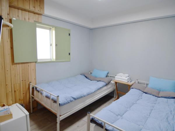 Insadong Hostel : photo 1 de la chambre chambre lits jumeaux avec salle de bains privative