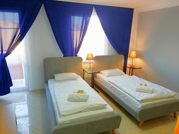 Great Polonia Wrocław City Center : photo 2 de la chambre chambre lits jumeaux