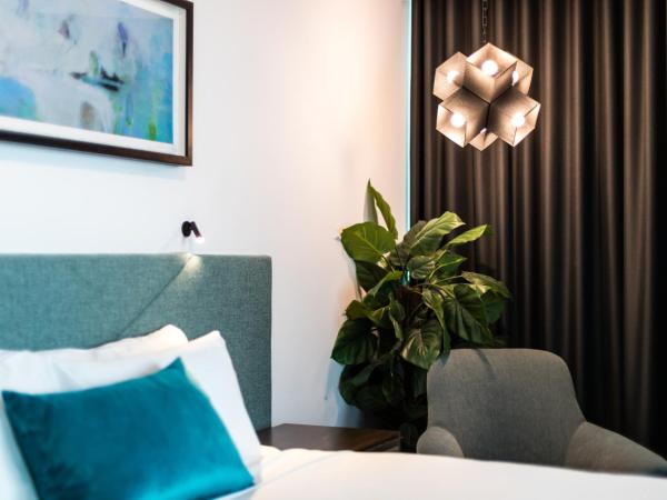 Eatons Hill Hotel : photo 6 de la chambre suite lit king-size