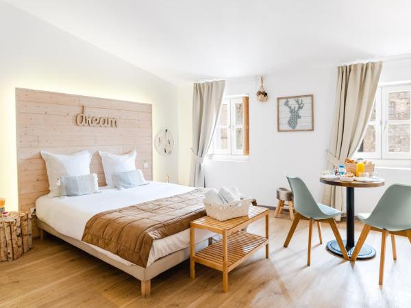 La Maison Gustave : photo 1 de la chambre suite junior - vue sur jardin - nature