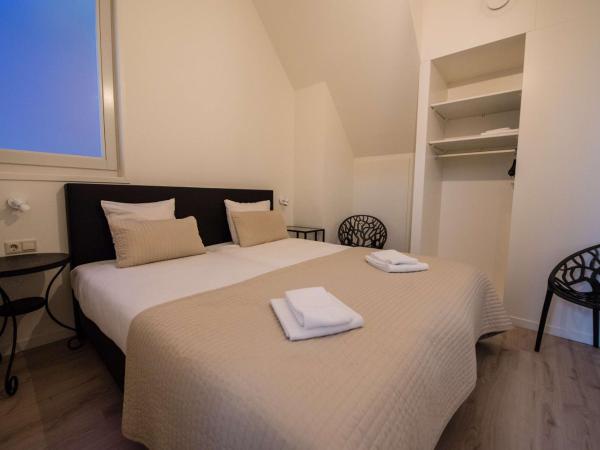 Flonk Hotel Groningen Centre, BW Signature Collection : photo 6 de la chambre two-bedroom apartment with four single beds and balcony