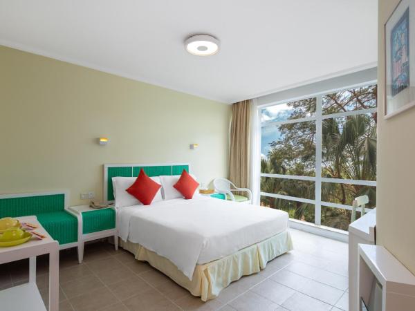 Sunshine Resort Intime Sanya : photo 1 de la chambre chambre double ou lits jumeaux - vue sur jardin