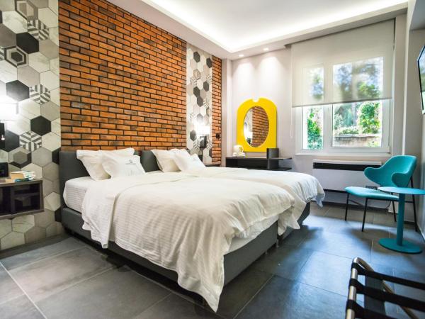 Palmyra Beach Hotel : photo 1 de la chambre chambre familiale - vue sur jardin