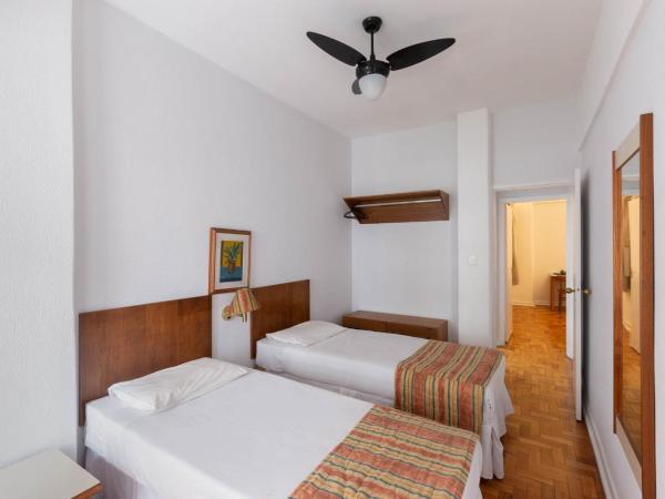 Hotel Rojas All Suite : photo 6 de la chambre suite exécutive avec 1 lit queen-size et 4 lits simples