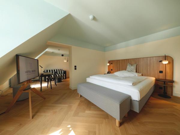 Best Western Plus Hotel Bern : photo 1 de la chambre appartement avec lit double et canapé-lit