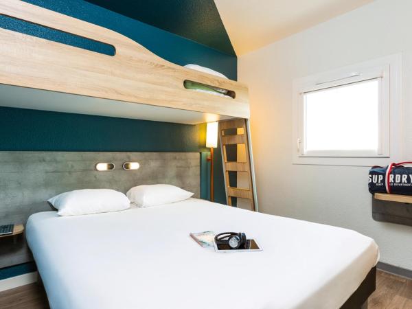Ibis Budget Perpignan Nord Rivesaltes : photo 3 de la chambre chambre double standard avec lit superposé
