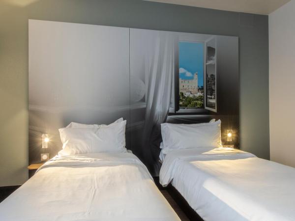 B&B HOTEL Orange - Échangeur A7 A9 : photo 2 de la chambre chambre lits jumeaux