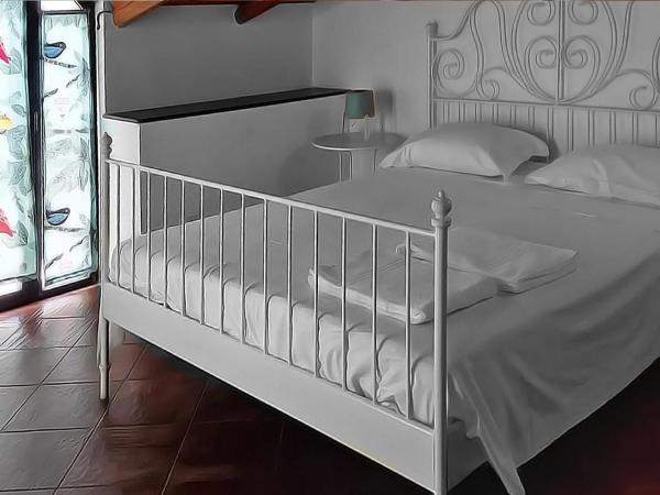 Le Coccole : photo 3 de la chambre chambre triple confort