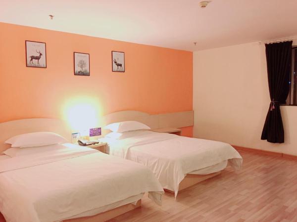 7Days Inn Guangzhou Shijing Jinbi Xincheng : photo 1 de la chambre chambre affaires lits jumeaux