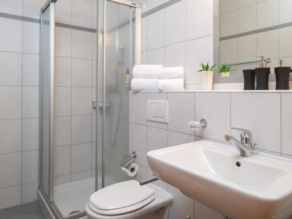 Petit Paradis : photo 2 de la chambre chambre simple avec salle de bains