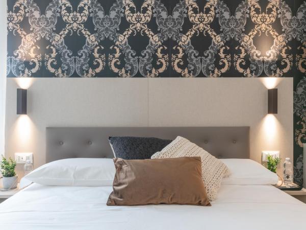 Grifoni Boutique Hotel : photo 5 de la chambre chambre triple de luxe