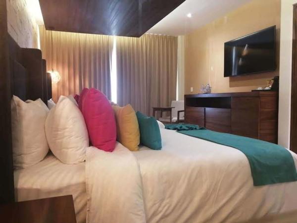 Hotel Beló Isla Mujeres - All Inclusive : photo 7 de la chambre suite junior de luxe avec 2 lits doubles