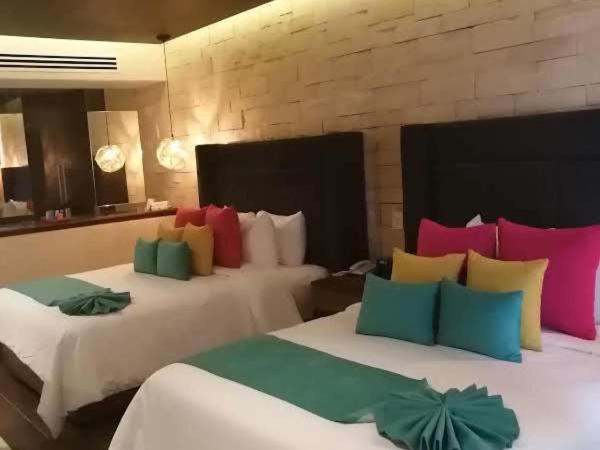 Hotel Beló Isla Mujeres - All Inclusive : photo 1 de la chambre suite junior de luxe avec 2 lits doubles