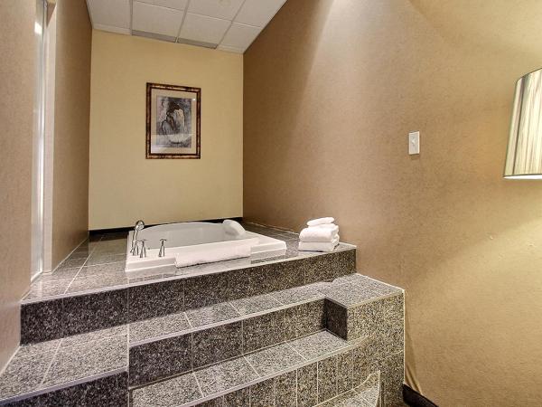 Hotel Classique : photo 4 de la chambre suite lit king-size avec baignoire spa
