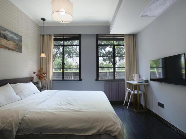 Shanghai Downtown Hills Boutique Guesthouse - Near Metro Line 7, Exit 3, Changping Road : photo 7 de la chambre kenya queen room with garden view