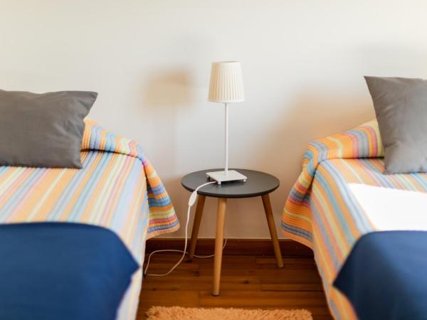 PKSC - Surfers Beach House : photo 2 de la chambre chambre lits jumeaux avec salle de bains commune