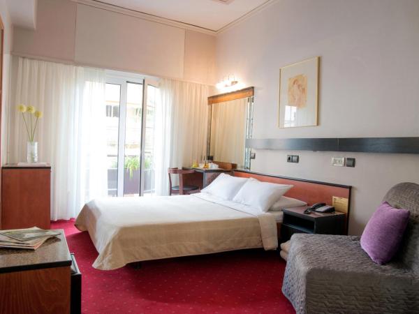 Victory Inn : photo 3 de la chambre chambre triple avec petit balcon