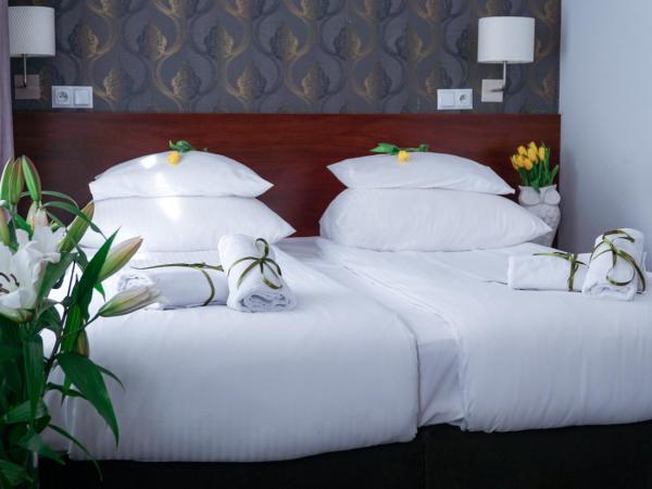City Center Rooms Piotrkowska 91 : photo 1 de la chambre chambre double ou lits jumeaux