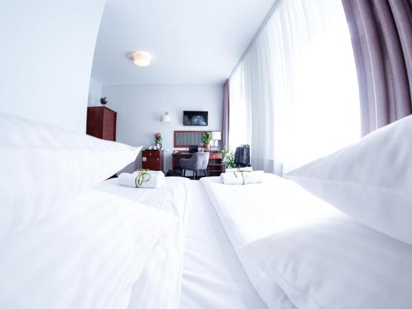City Center Rooms Piotrkowska 91 : photo 6 de la chambre chambre double ou lits jumeaux