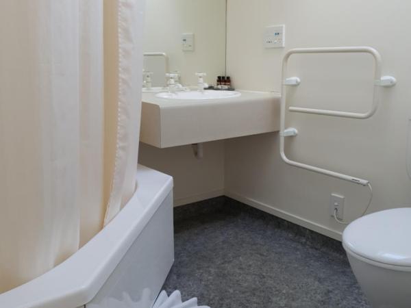 Rosewood Court Motel : photo 4 de la chambre studio avec baignoire spa