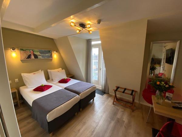 Alp Hotel : photo 3 de la chambre chambre lits jumeaux avec baignoire spa et balcon - vue sur jardin