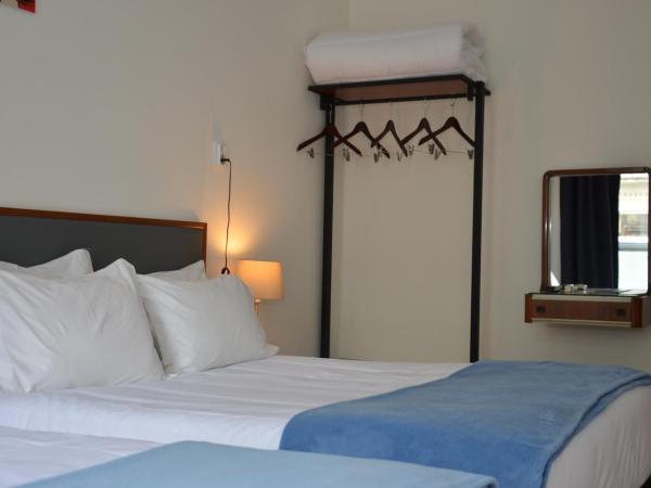 Hotel Girassol : photo 4 de la chambre chambre triple